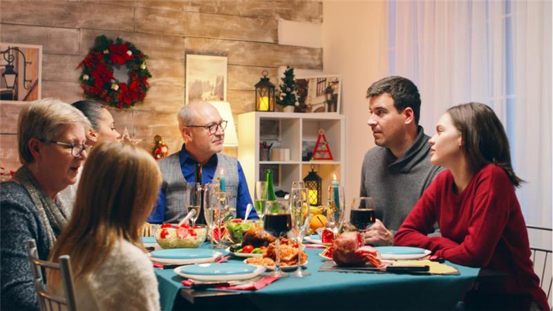 Family gathered around holiday table